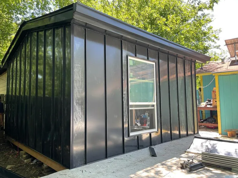 Black standing seam metal wall panels for Metal Roof Installation in Gray