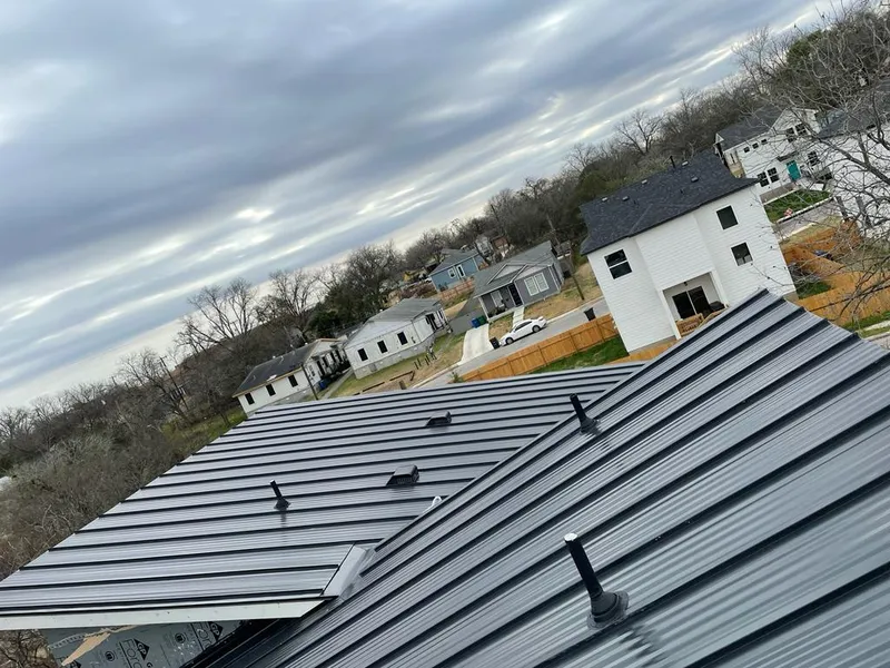Standing seam metal roof panels with vents for Skylight Repair in Gray